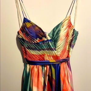 Full length vibrantly coloured gown.